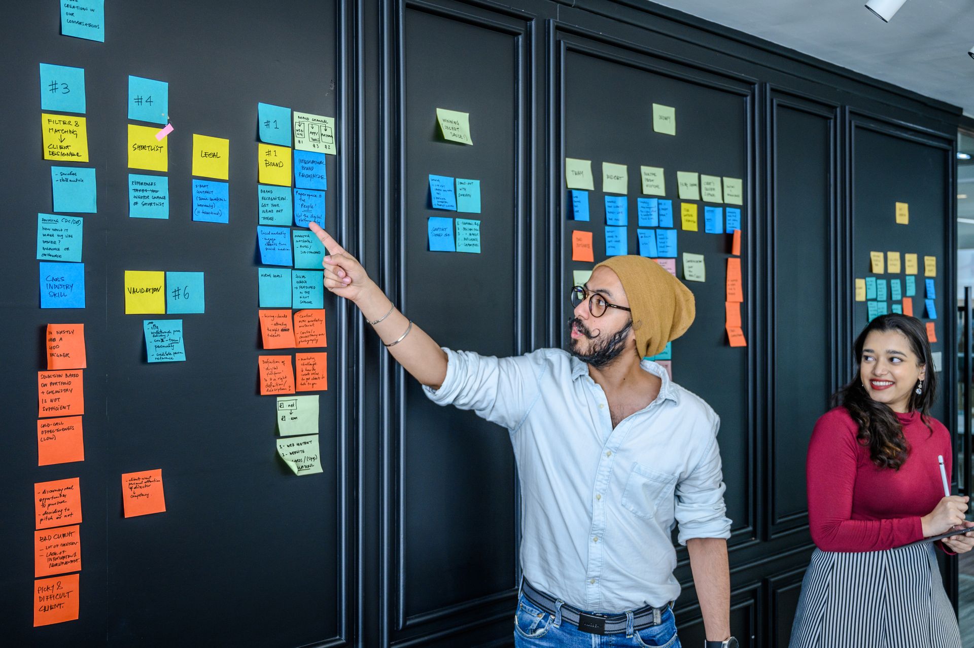 Man standing in front of a brand visioning wall